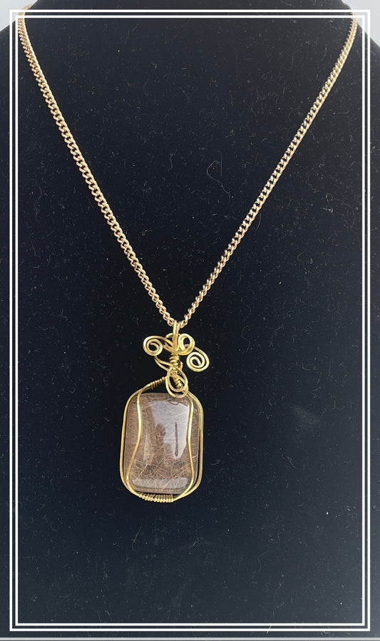 SQ0001 Rutilated Smokey Quartz Wrapped In Gold-Colored Wire With Gold-Colored Chain